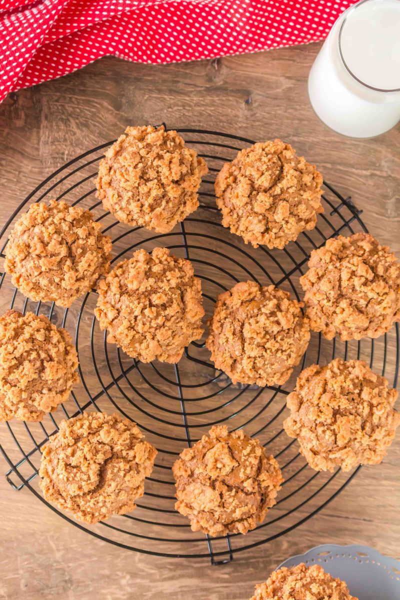 Top down view of gingerbread muffins on a cooling rack.