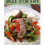 Front view of a stir fry made with beef strips sitting on a bed of white rice. Hostess At Heart.