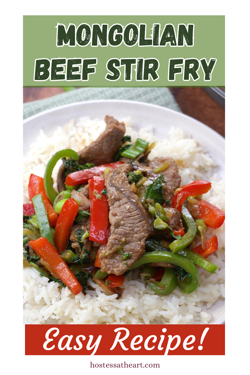 Front view of a stir fry made with beef strips sitting on a bed of white rice. Hostess At Heart.