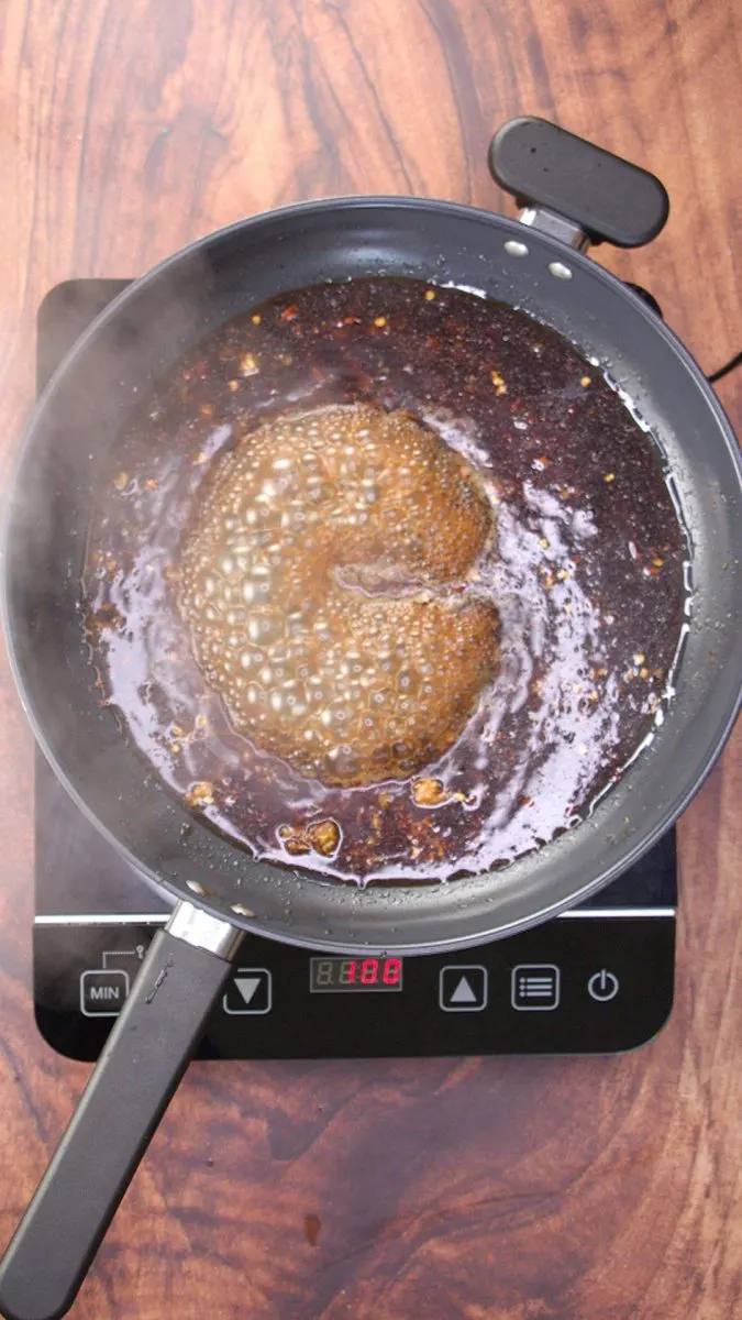 Asian sauce ingredients cooking in a skillet until thickened. Hostess At Heart