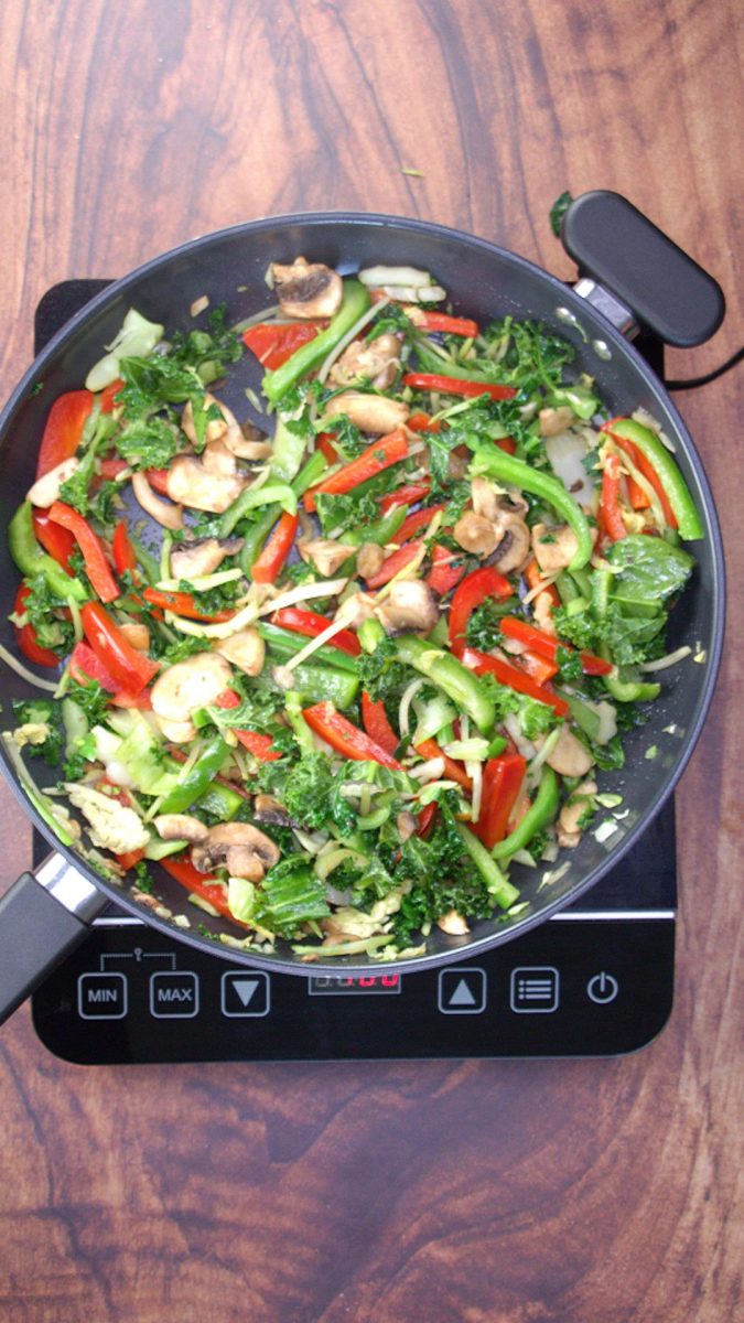 Bright Veggies including mushrooms, peppers, onions, and brocoli slaw sauteed in a skillet