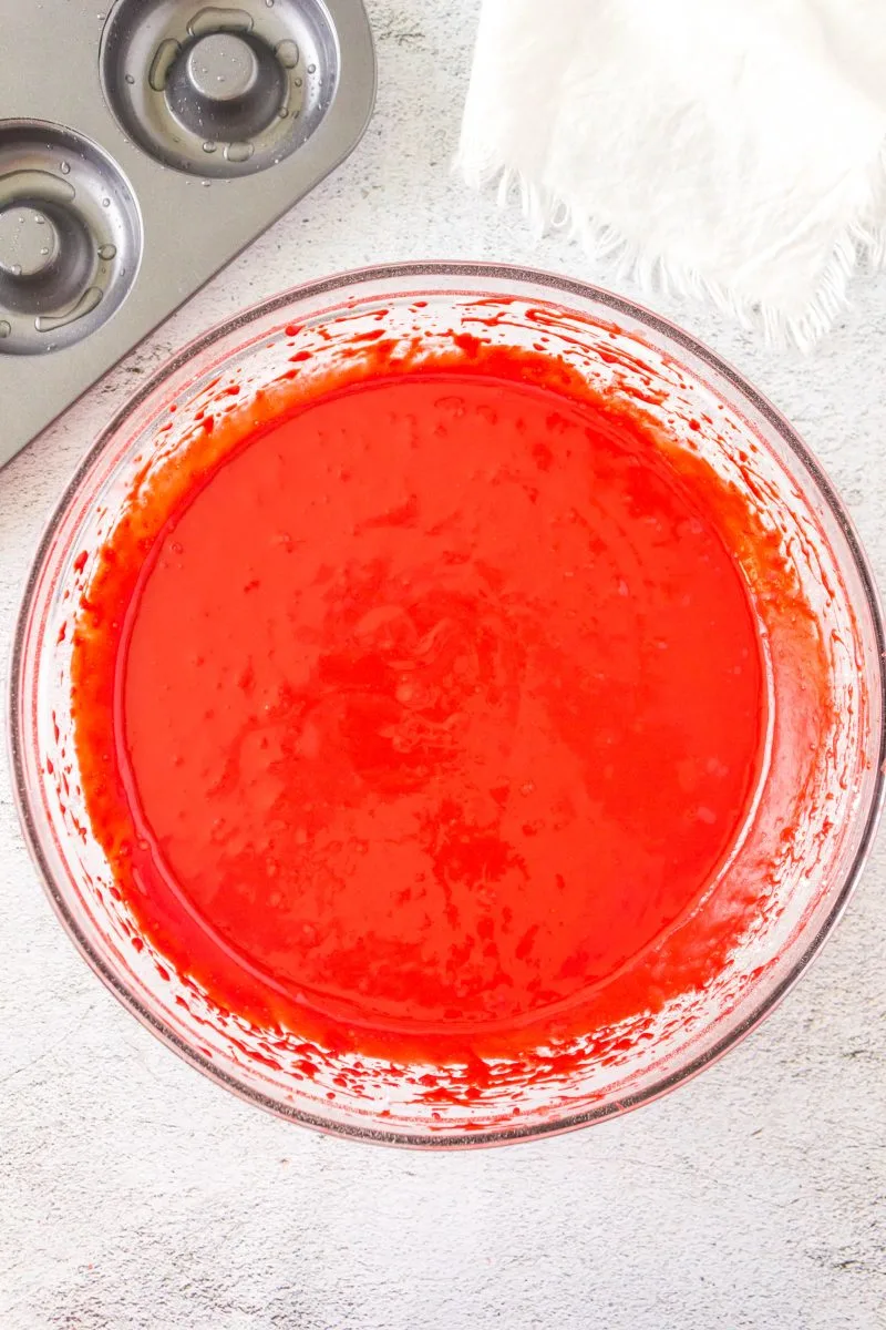 A mixing bowl filled with red velvet cake mix donut batter Hostess At Heart