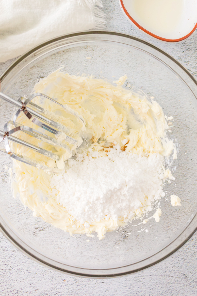 Mixing bowl filled with creamy vanilla glaze