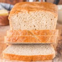 Front view of a sliced loaf of soft rye bread baked golden brown - Hostess At Heart