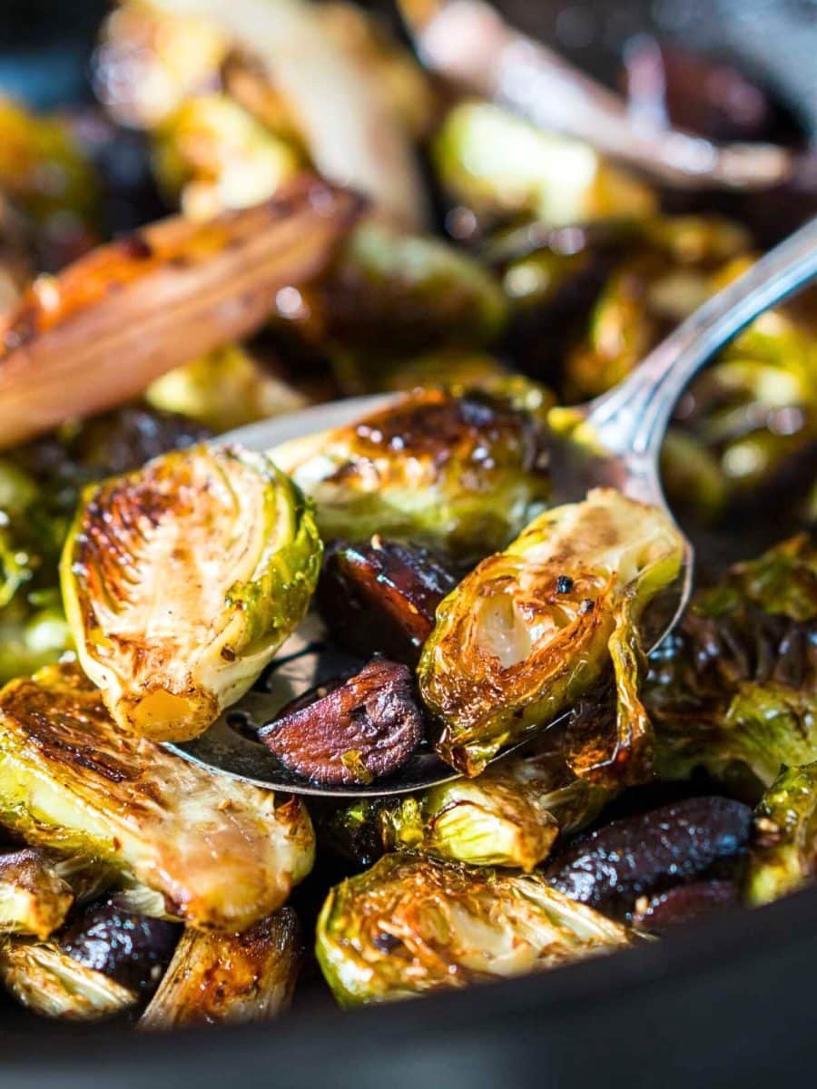 Close-up image of browned roasted Brussels Sprouts and Mushrooms on a spoon - Hostess At Heart