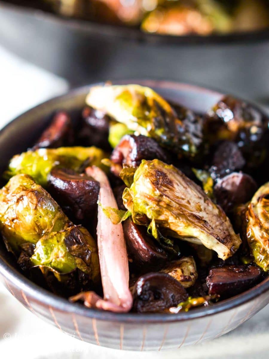 Closeup bowl containing roasted Brussel Sprouts, shallots and mushrooms. Hostess A Heart