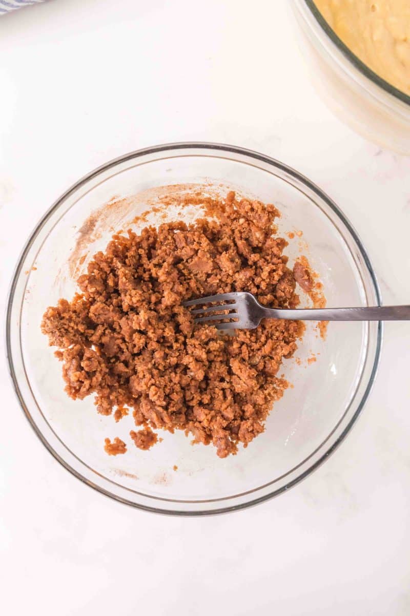 Cinnamon streusel crumbles in a mixing bowl - Hostess At Heart