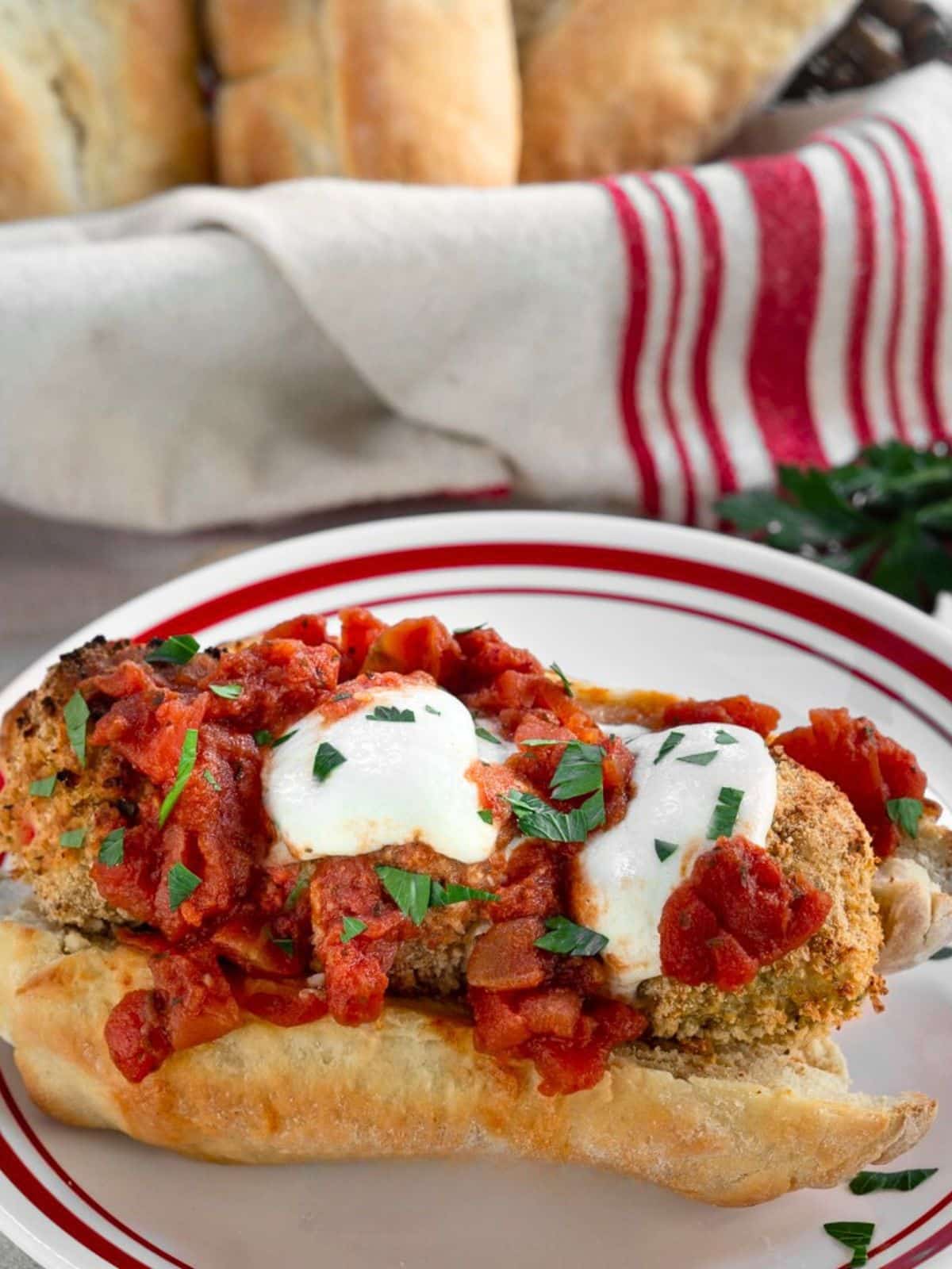 A a large sub sandwich stuffed with baked chicken meatballs topped with melted mozzarella and tomato marinara. Hostess At Heart