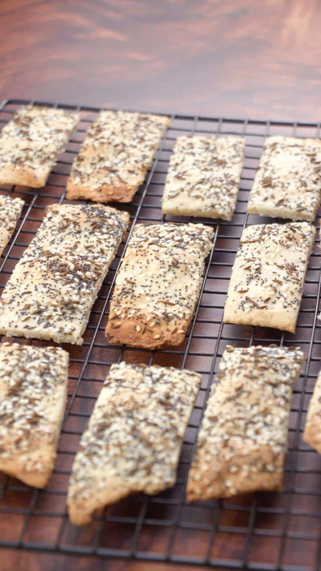 Homemade crackers on a  cooling rack, vertical and distant view.