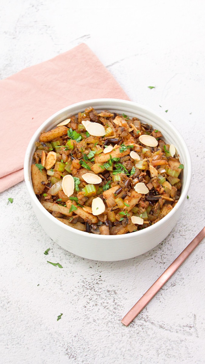 A high view of a bowl of cooked chinese rice mixed with five spice seasoning, celery, chestnuts, and mushrooms. Hostess At Heart