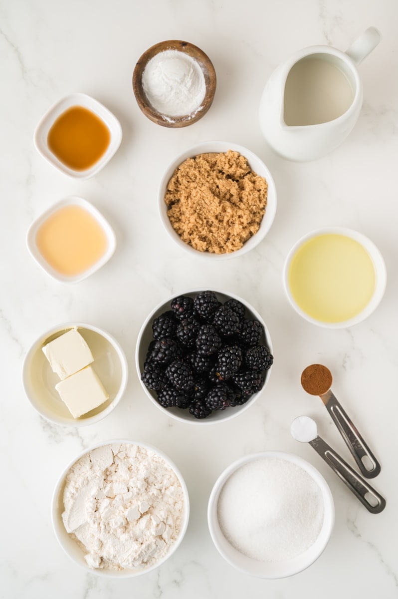 Ingredients: Flour, baking soda, baking powder, milk, vinegar, brown sugar, blackberries, butter, vegetable oil, sugar, cinnamon, vanilla.