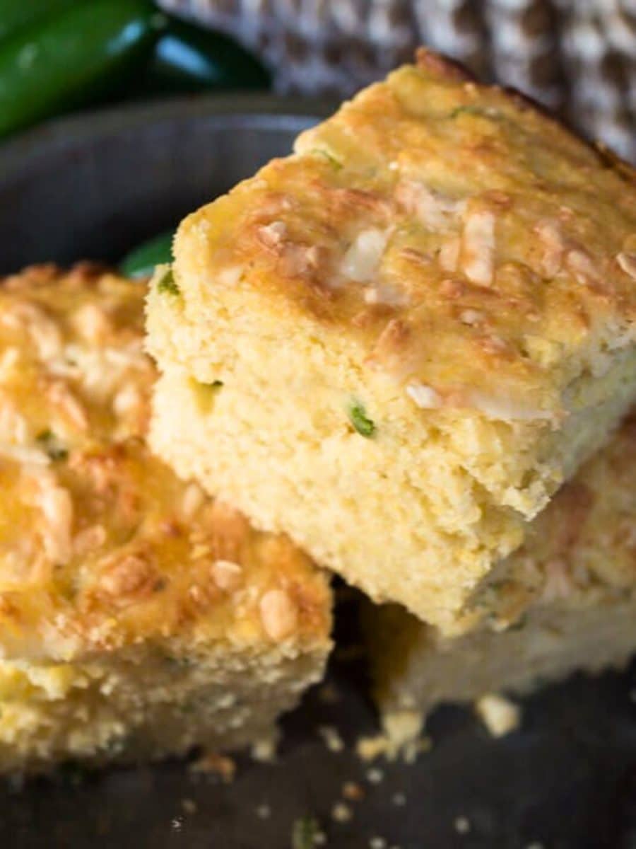 A stack of three slices of jalapeno cheddar cornbread. - Hostess At Heart
