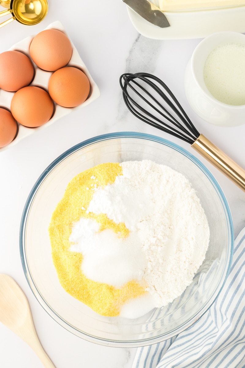 Cornbread dry ingredients added to a bowl