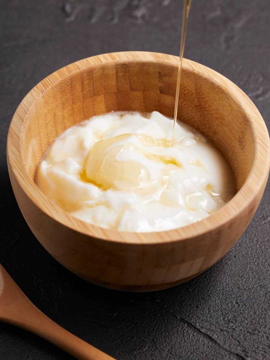 A small wooden bowl of whipped butter drizzled with honey - Hostess At Heart