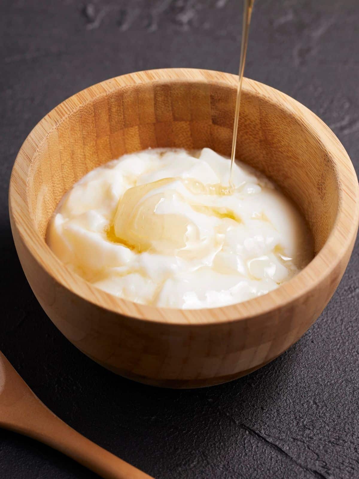 A small wooden bowl of whipped butter drizzled with honey - Hostess At Heart