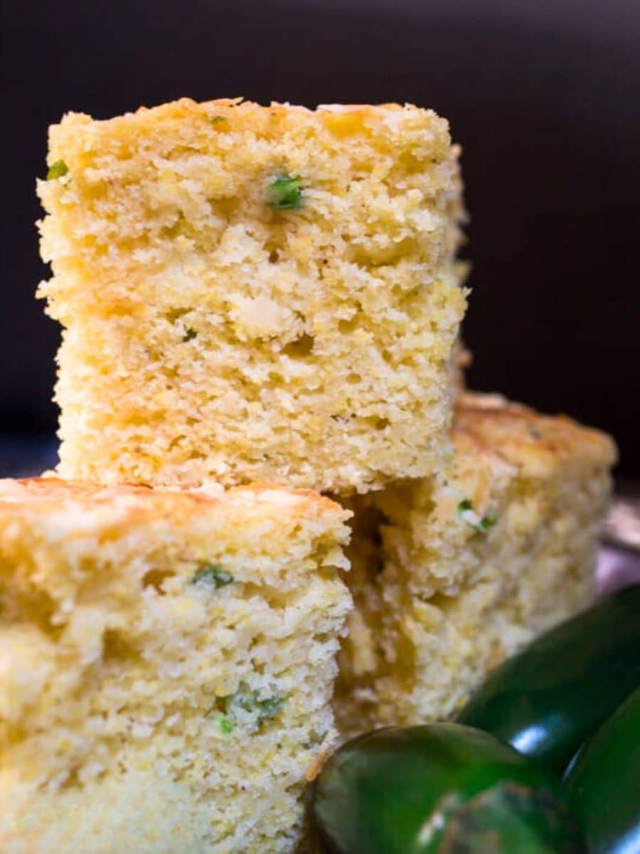 Tableview of three slices of jalapeno cheese corn bread stacked on each other. Hostess At Heart