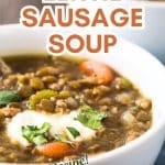 An image for Pinterest of a bowl of hearty lentil sausage soup with vegetables. Hostess At Heart