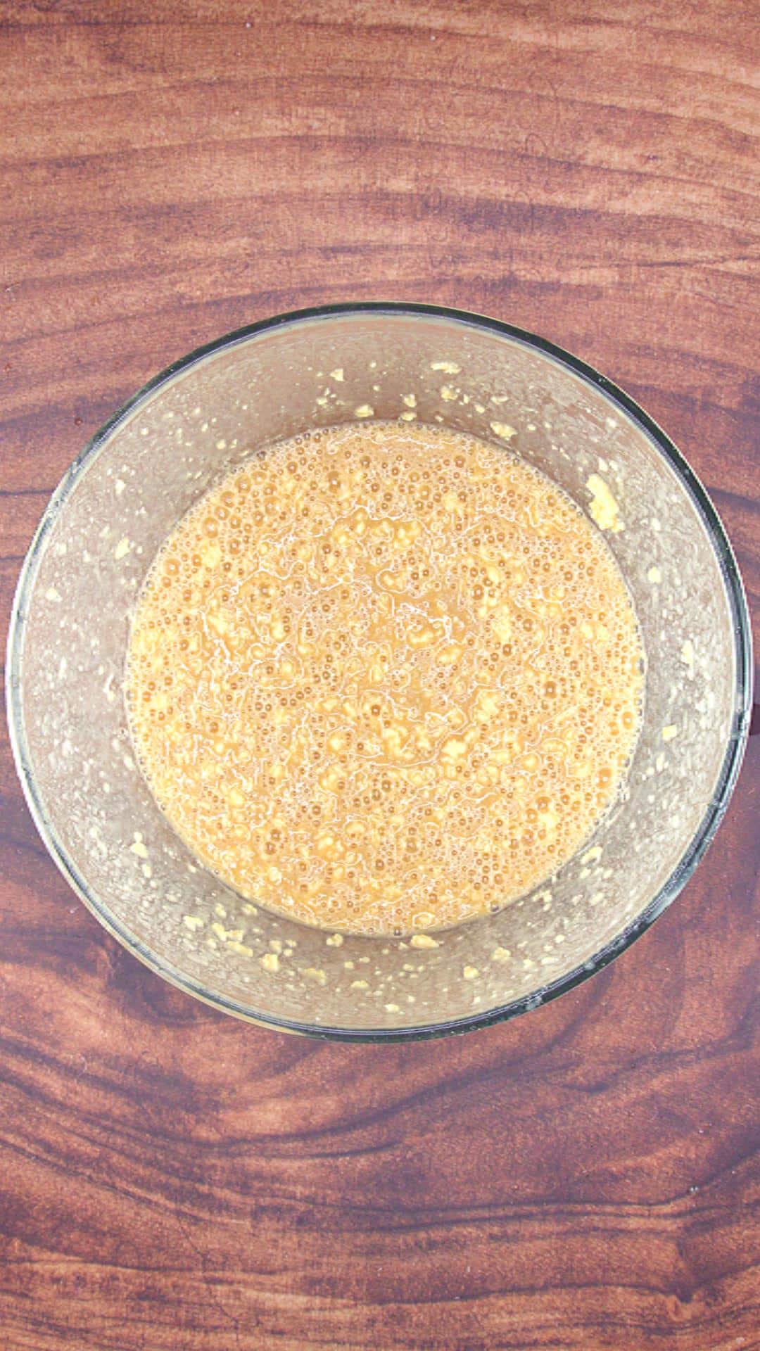 Apple spice cake wet ingredients combined in a mixing bowl. Hostess At Heart