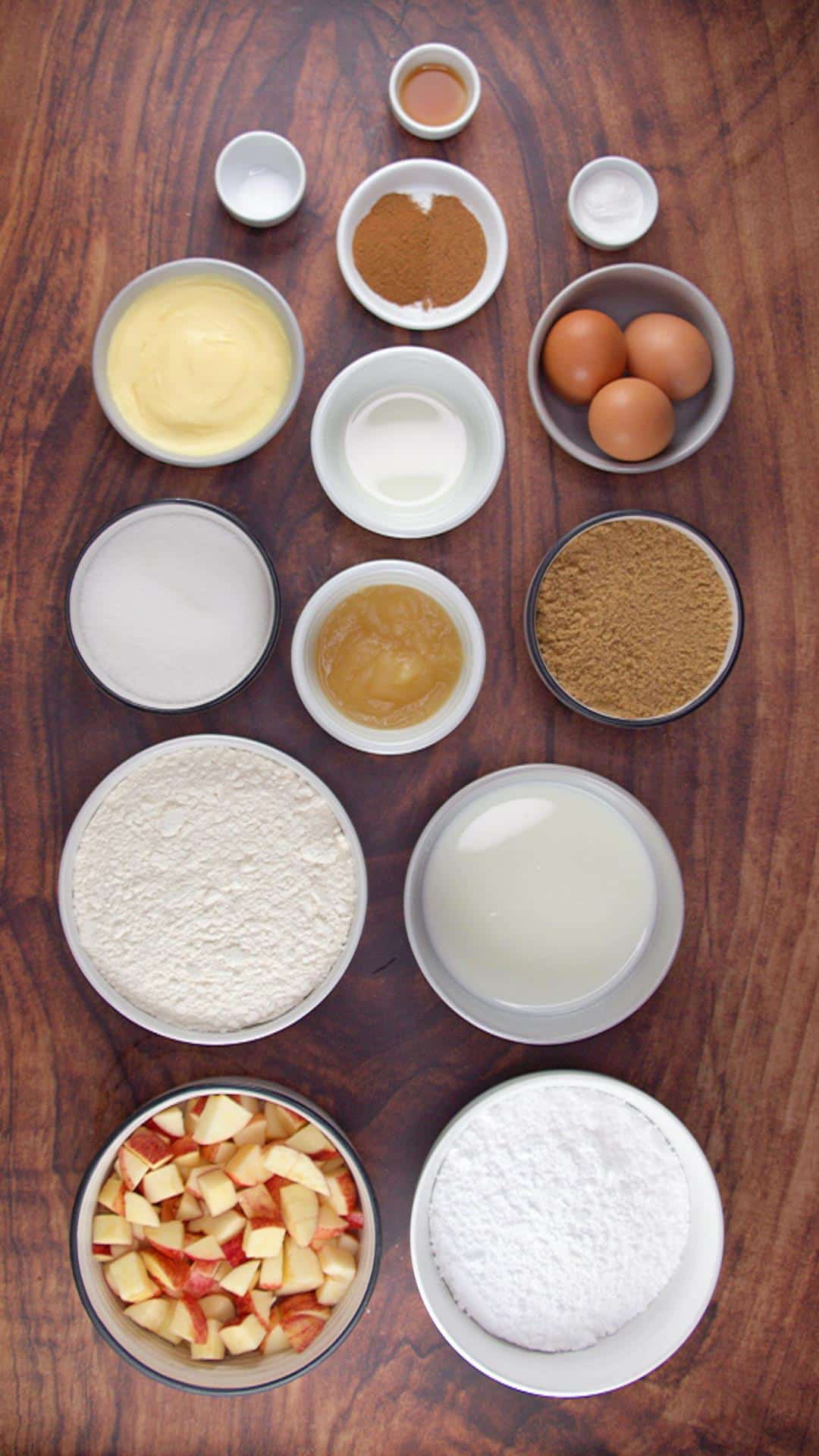 Apple Spice Cake Recipe with Caramel Icing Ingredients: Diced apples, cake flour, cinnamon, nutmeg, powdered sugar, butter, brown sugar, buttermilk, eggs, vanilla, and baking powder.