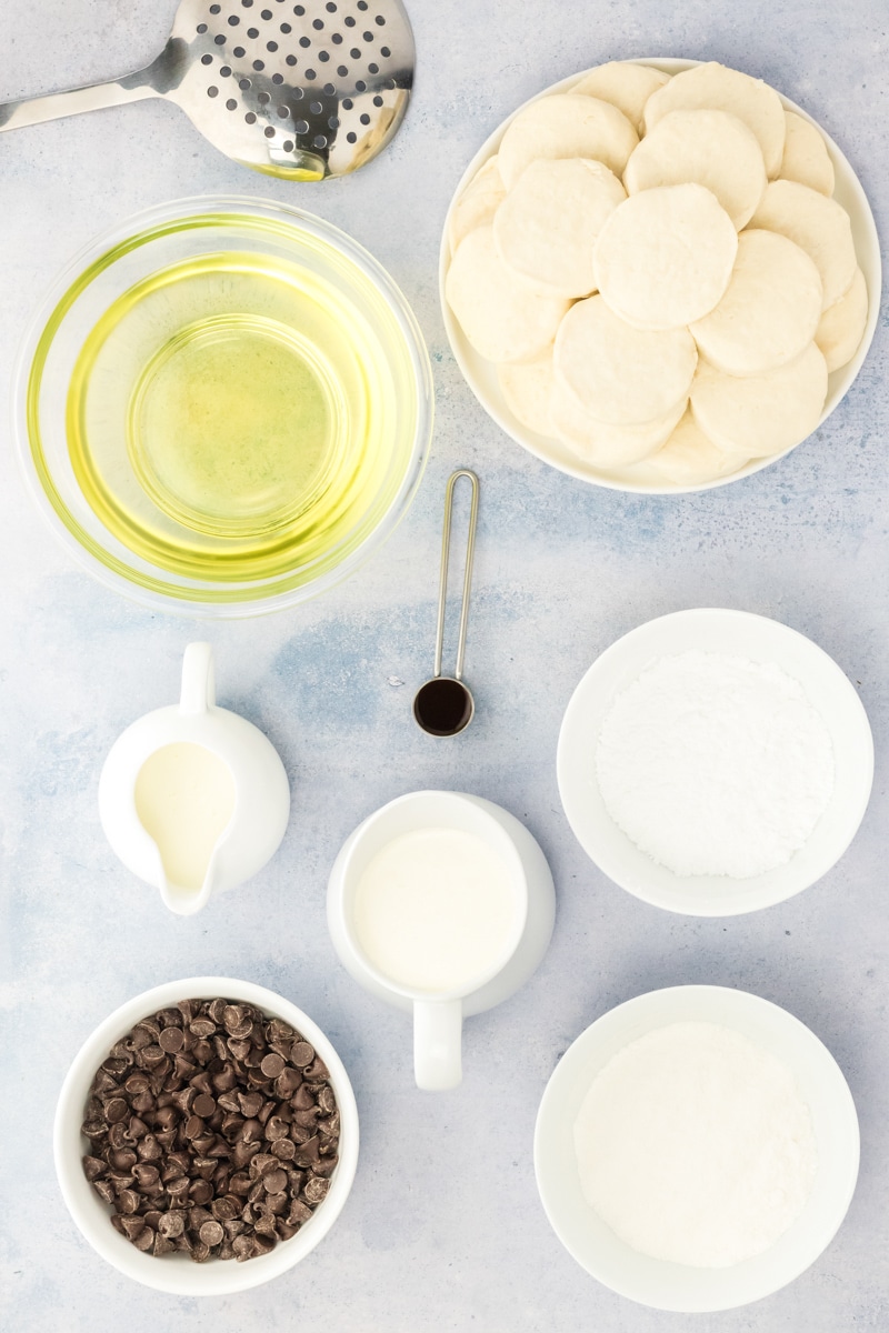 Boston Cream Donut Ingredients: Ready made biscuits, oil for frying, chocolate chips, cream, instant pudding, powdered sugar, and vanilla. Hostess At Heart