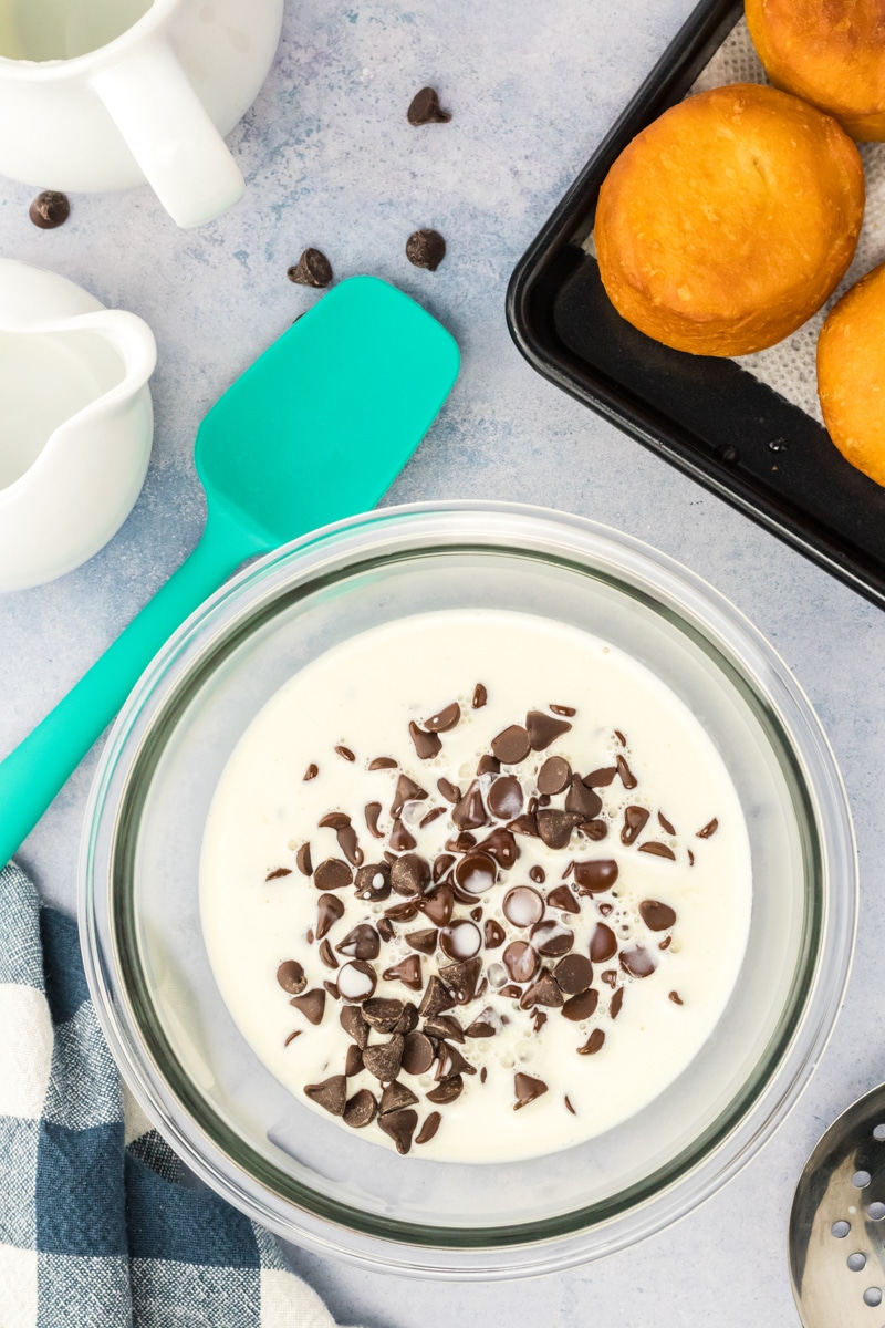 Chocolate chips combined with cream in order to make a chocolate ganache. Hostess At Heart
