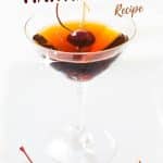 Front view of a cocktail glass filled with a Rum Manhattan and a Bada cherry. Hostess At Heart