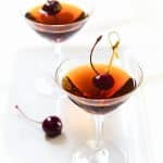 Front angle of a classic manhattan cocktail made with rum instead of whiskey - Hostess At Heart