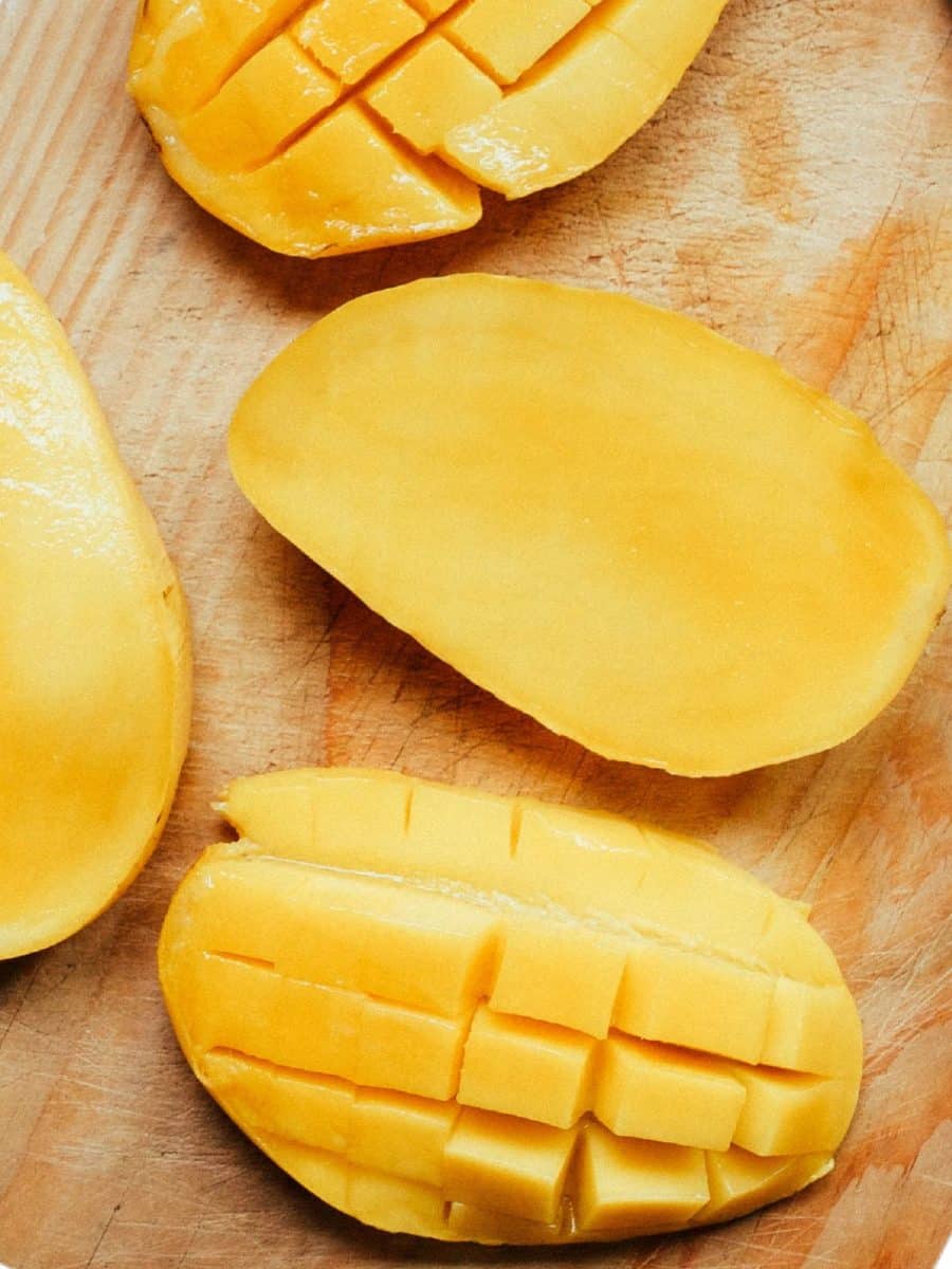 Cutting board with a diced adhering to the mango peel. Hostess At Heart
