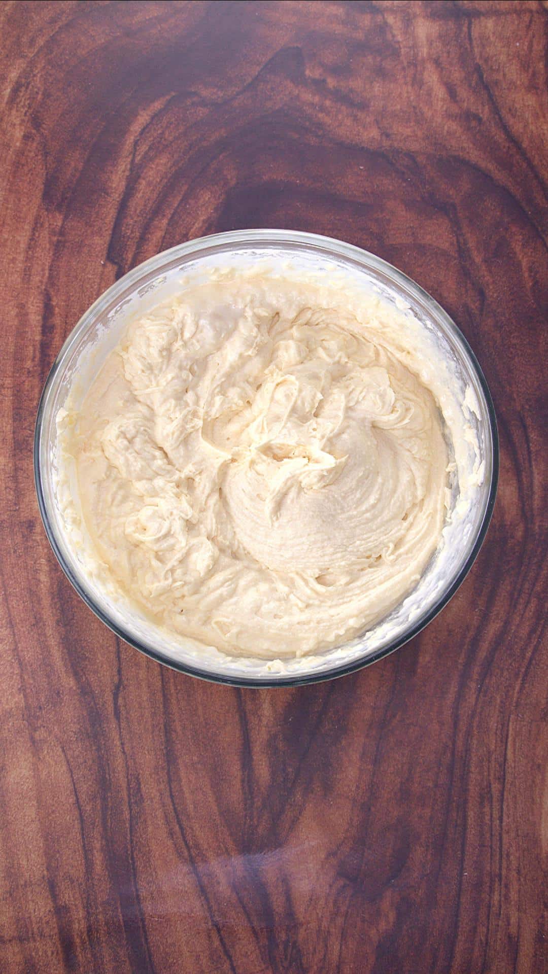 Top down view of a bowl filled with thick cake batter - Hostess At Heart