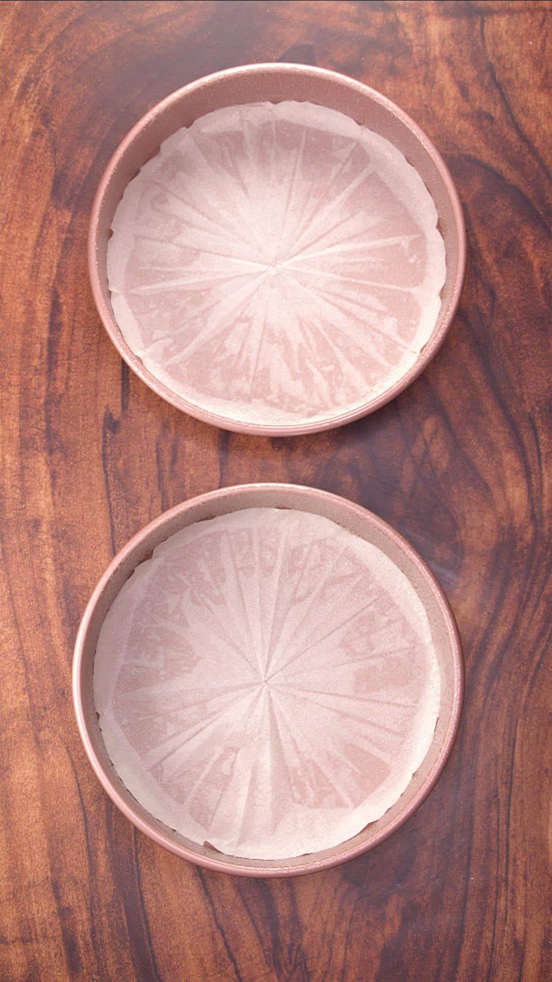 Two round cake pans lined with parchment paper - Hostess At Heart