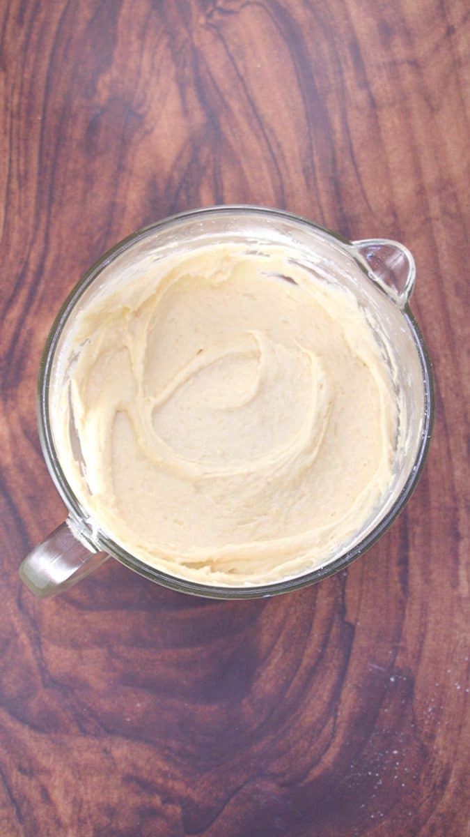 Mixed cake batter in a measuring cup - Hostess At Heart