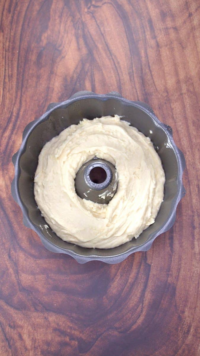 The first layer of cake batter added to a bundt cake - Hostess AT Heart