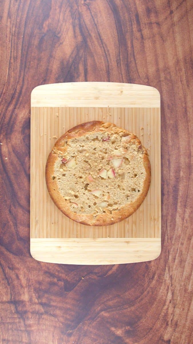 The top of a round apple cake sliced off in order to frost it and stack it with another layer. Hostess At Heart