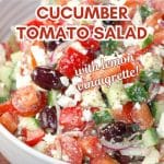 A tableview image for Pinterest of a salad made with fresh tomatoes, cucumber, olives and Feta. A lemon vinaigrette dressed the salad.