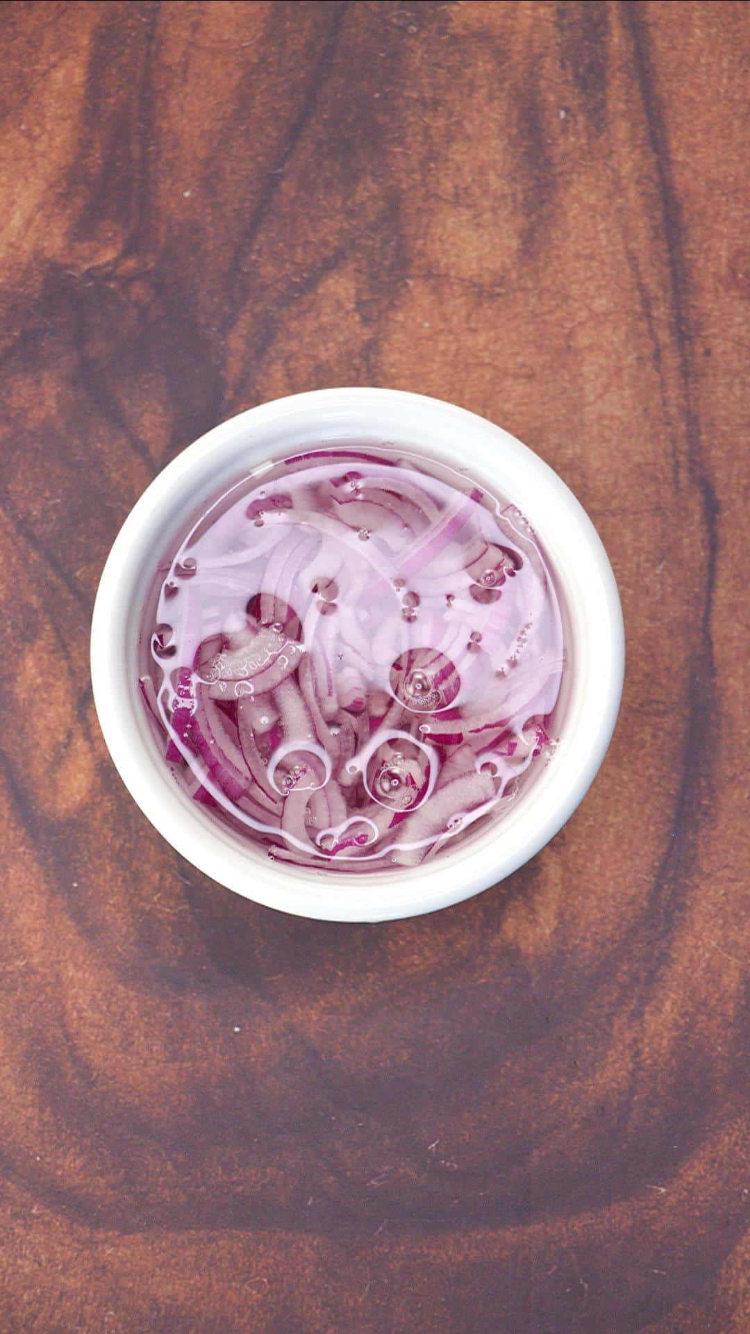 Onions soaking in cold water.
