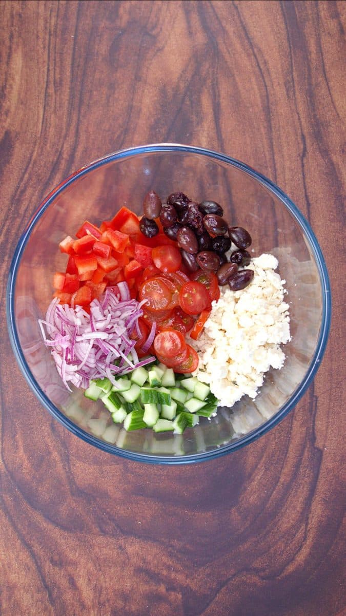 Chopped ingredients in a salad bowl waiting to be mixed. 