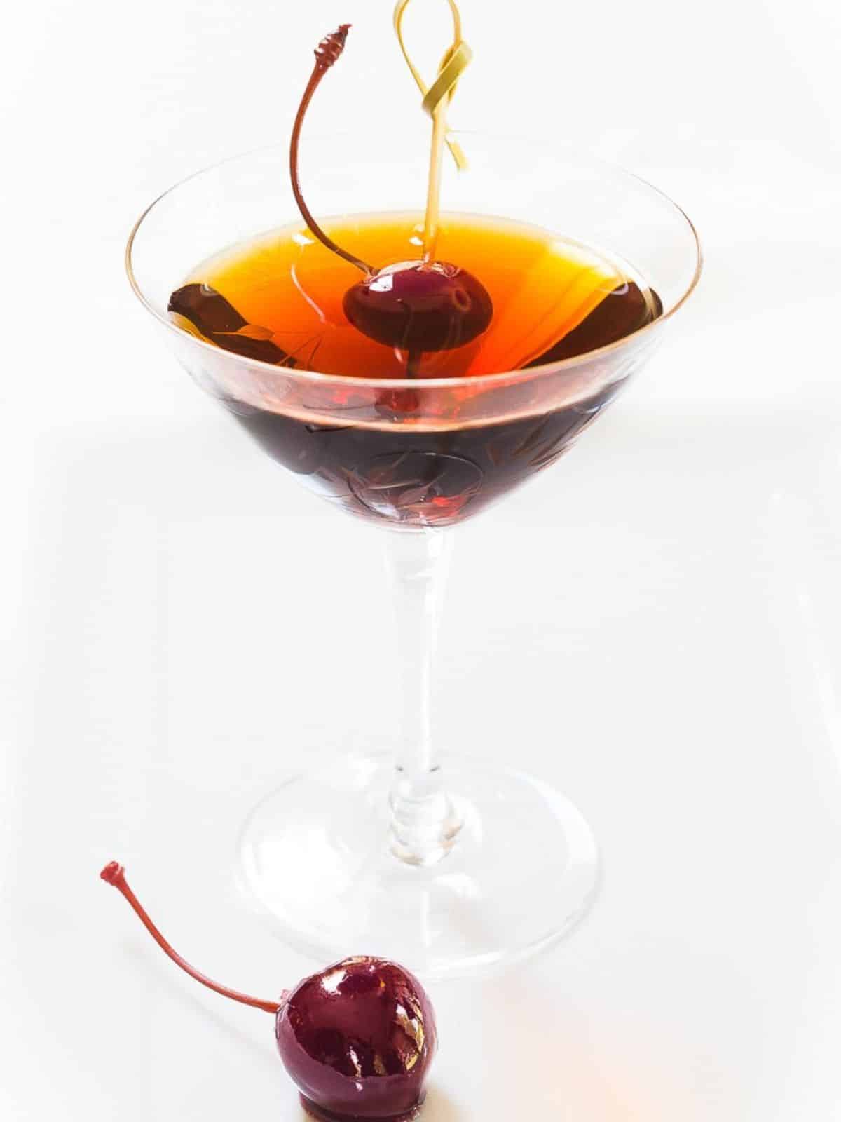 Front view of a Cuban cocktail made with rum in a coupe glass. Hostess At Heart