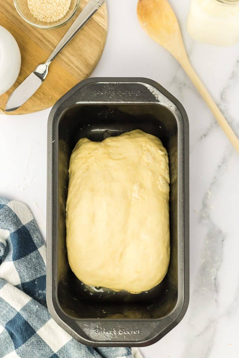Shaped bread dough in a loaf pan - Hostess At Heart