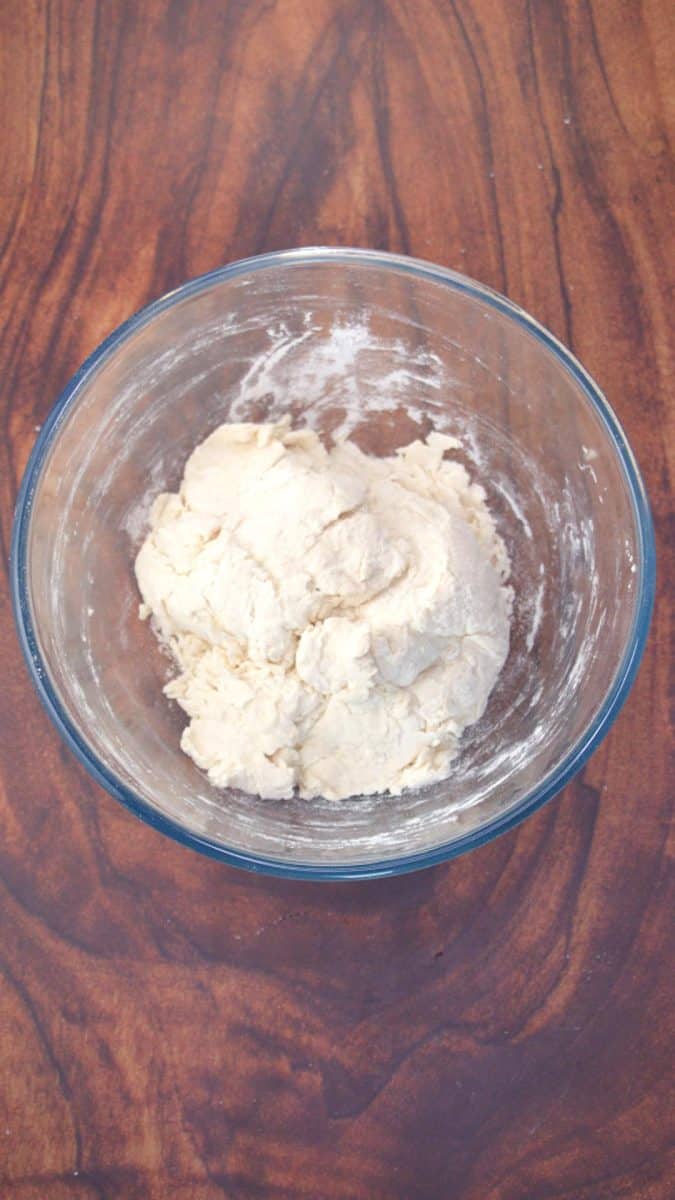 Scraggy lump of bread dough sitting in a mixing bowl. Hostess At Heart