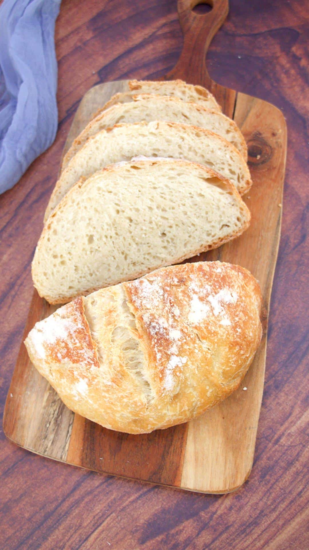 Front view of a sliced boule of homemade bread - Hostess At Heart