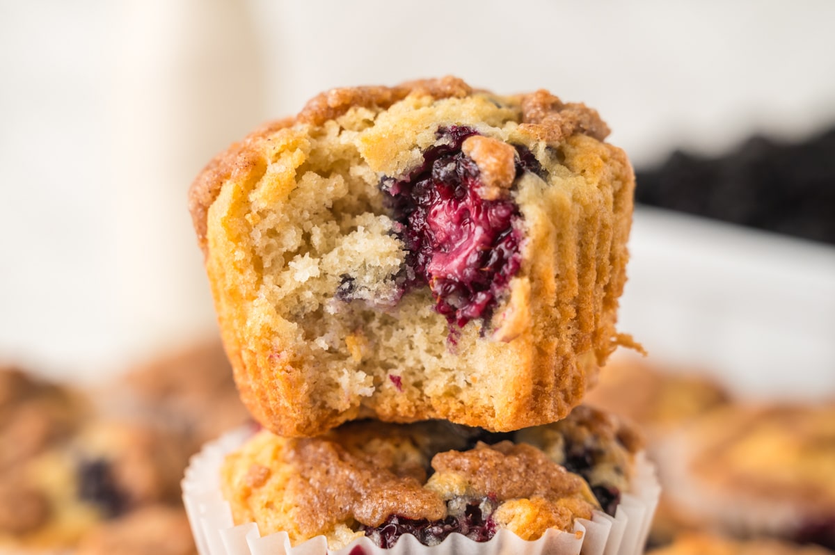 Close up of blackberry muffin with a bite removed.