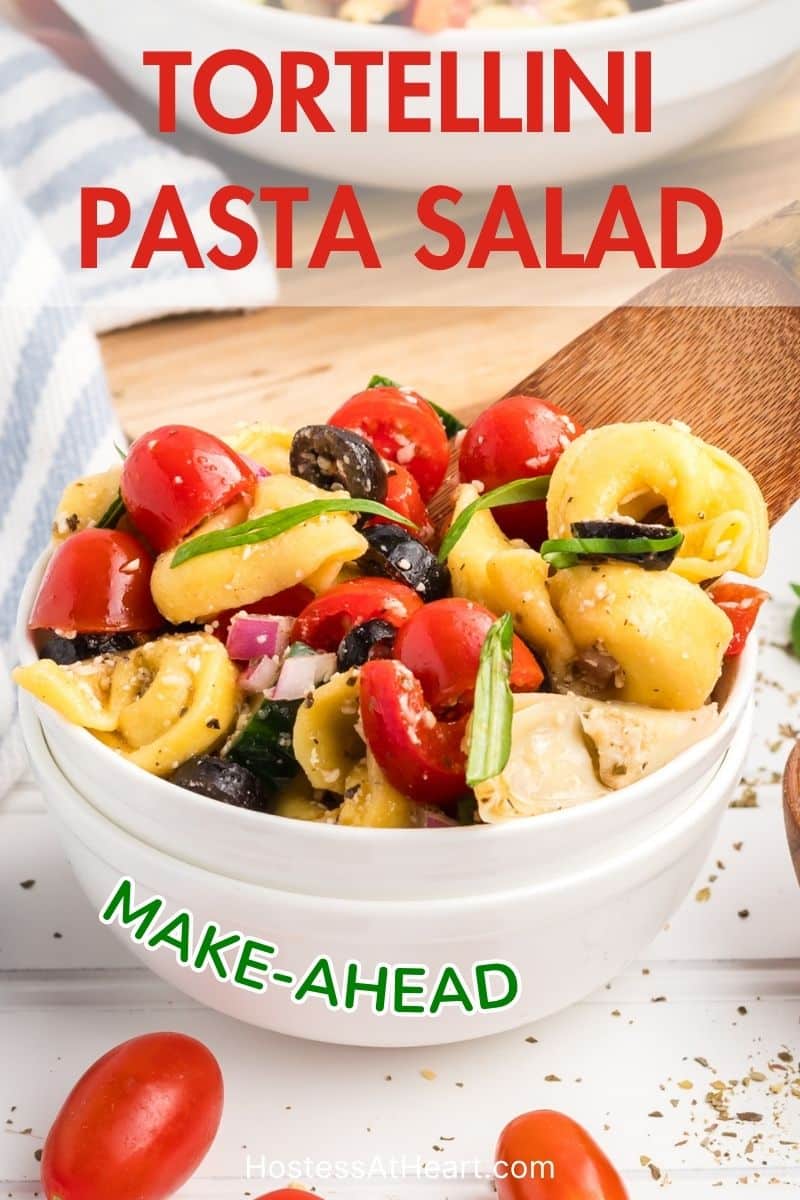 Image for Pinterest of a bowl filled with a colorful summer cheese tortilla pasta salad - Hostess At Heart