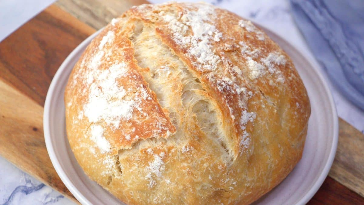A top-down view of a loaf of homemade no knead bread - Hostess At Heart
