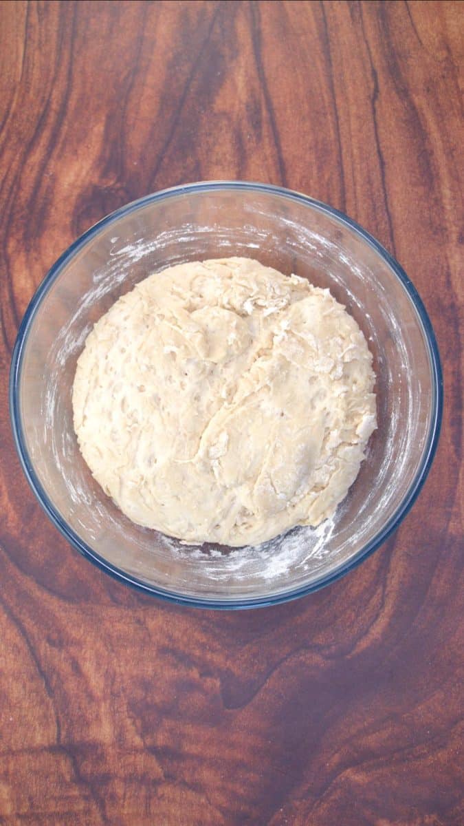 A mixing bowl filled with homemade bread dough - Hostess At Heart