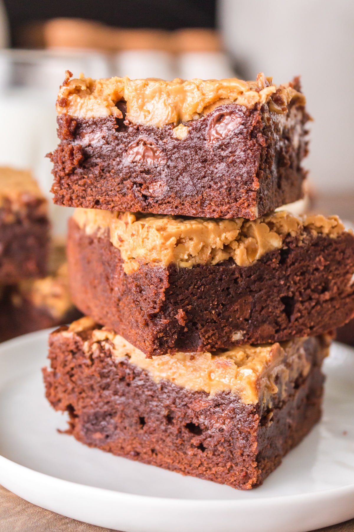 3 moist fudgy brownies filled and swirled with peanut butter stacked on each other. Hostess At Heart