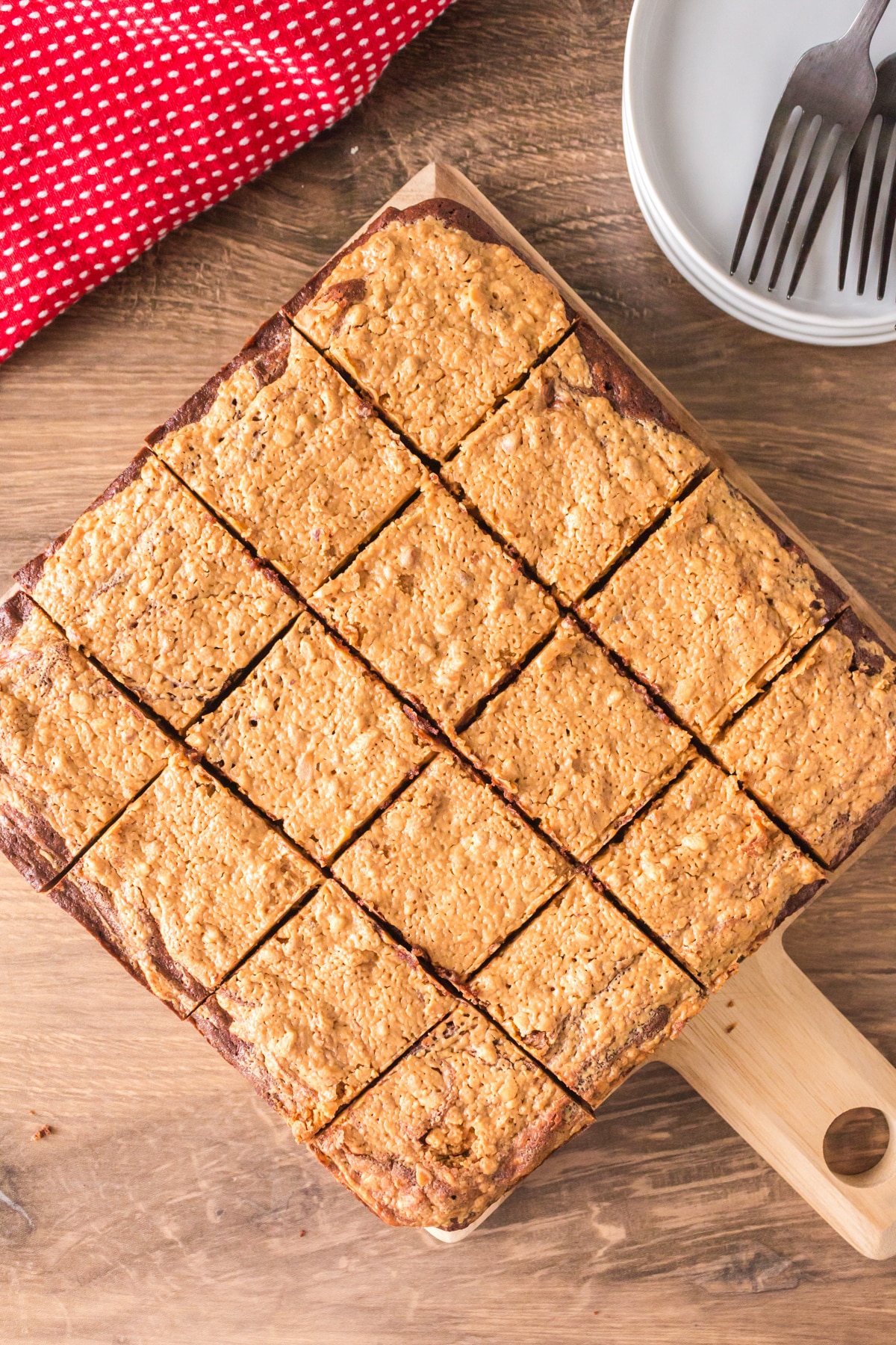 Top down view of a cutting board topped with chocolate peanut butter swirl bars - Hostess At Heart