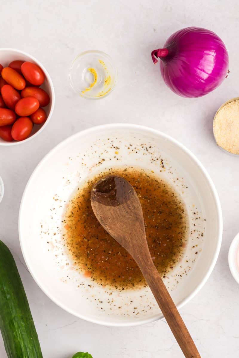 A bowl of red wine tortellini salad dressing. Hostess At Heart