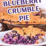 An image for Pinterest of a slice of blueberry crumble pie sitting in front of the baked pie.