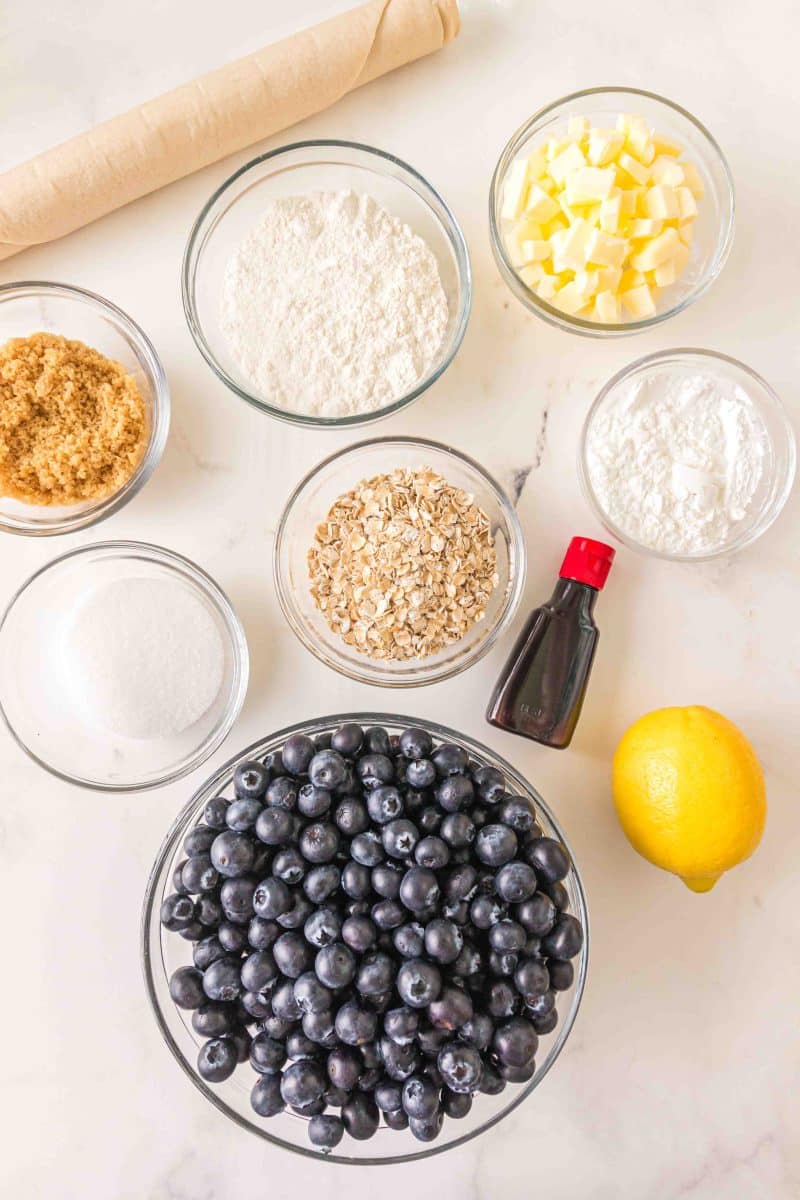 Blueberry crumble pie recipe ingredients: Fresh blueberries, lemon, flour, sugar, vanilla, butter, brown sugar, and cornstarch - Hostess At Heart