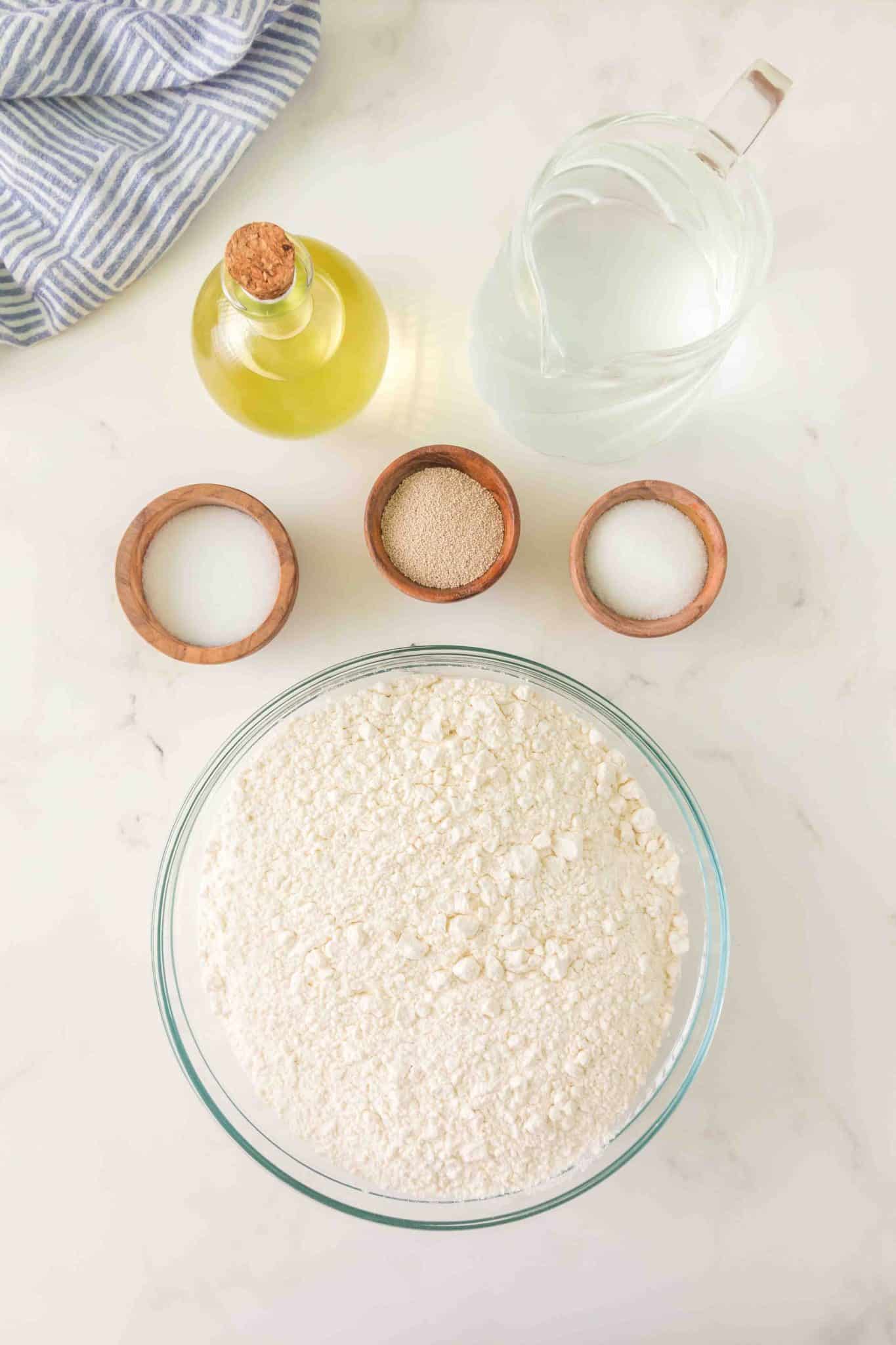 Ingredients used to make bread bowls: flour, salt, yeast, olive oil, water, and sugar. Hostess At Heart